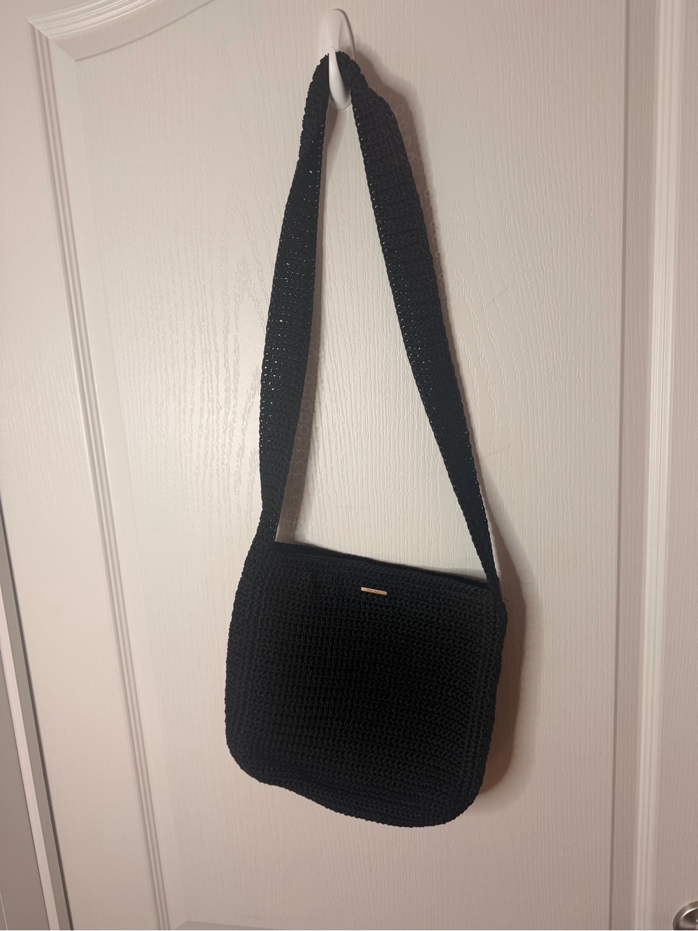 The SAK Black Crochet Crossbody Bag with Wide Shoulder Strap